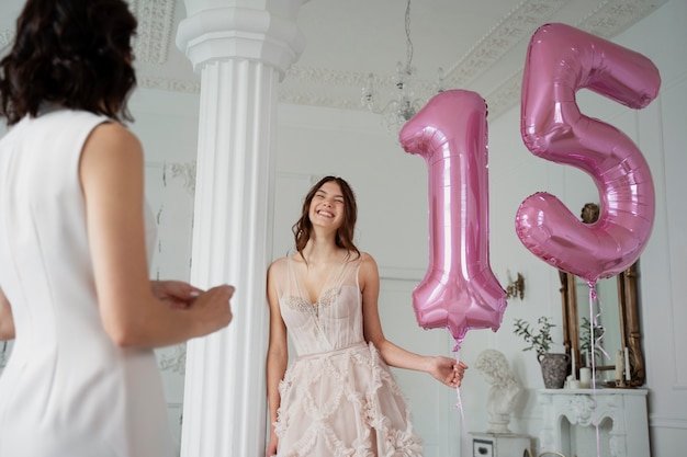 Free photo medium shot smiley girl with balloons