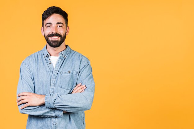 Medium shot smiley guy with crossed arms