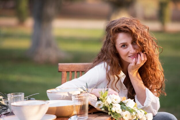 Medium shot smiley influencer at table