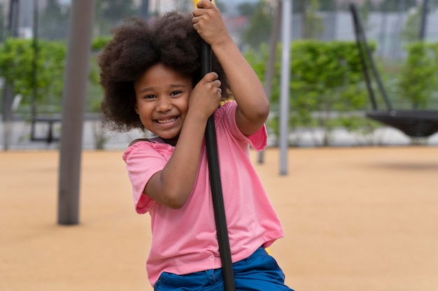 Medium shot smiley kid outdoors