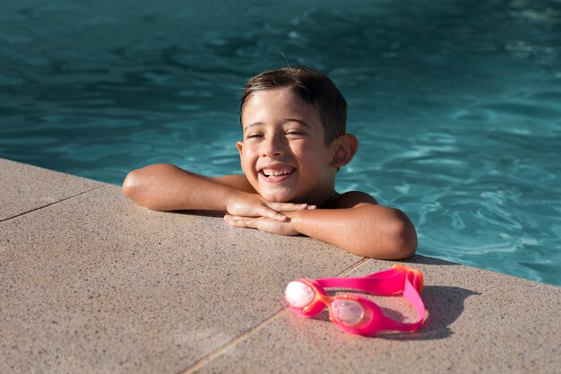 Medium shot smiley kid in pool