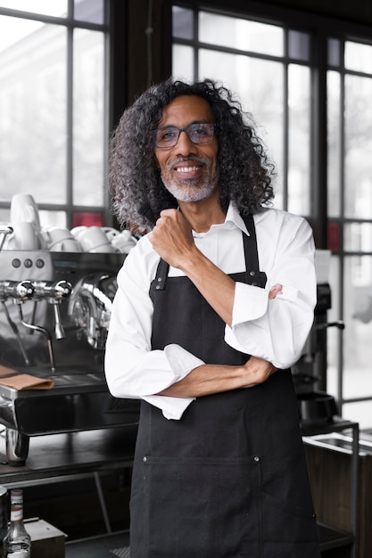 Free Photo medium shot smiley man in coffee shop