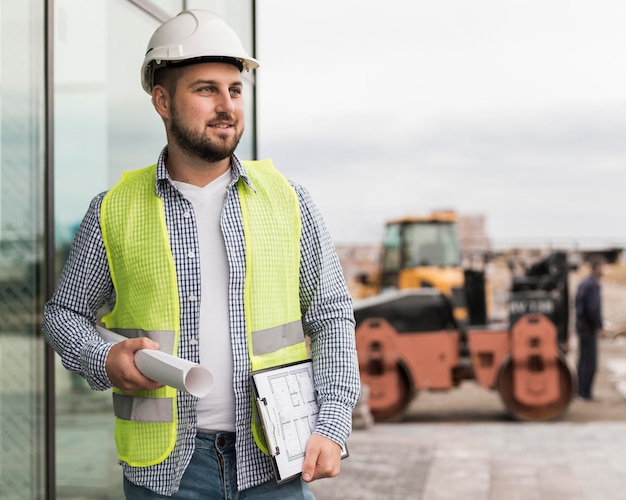 Medium shot smiley man holding project