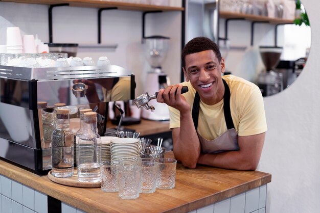 Medium shot smiley man making coffee