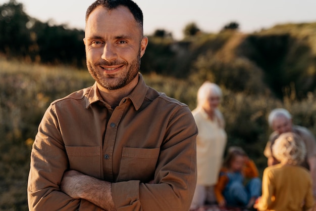 Free photo medium shot smiley man in nature