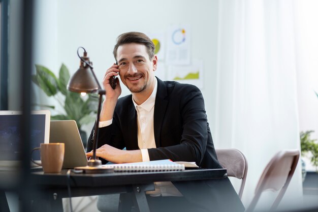 Medium shot smiley man talking on phone