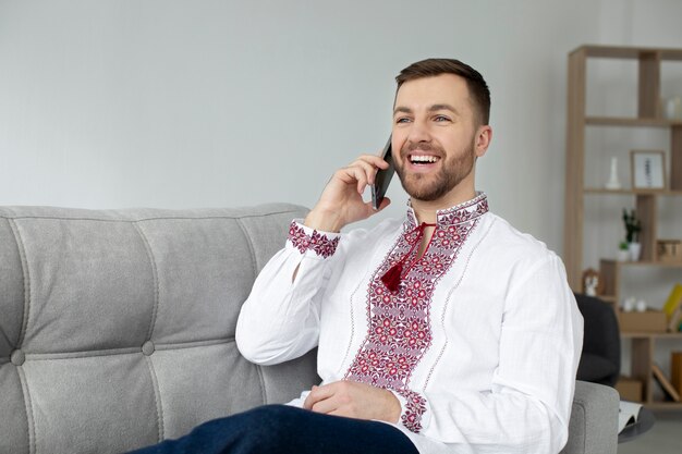 Medium shot smiley man talking on phone