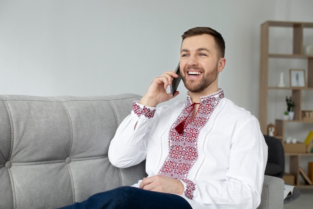 Medium shot smiley man talking on phone