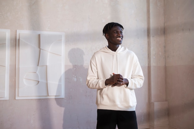 Medium shot smiley man wearing white hoodie