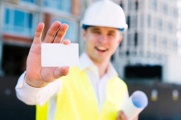 Free Photo medium shot smiley man with business card