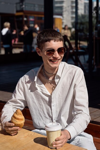 Medium shot smiley man with chain necklace