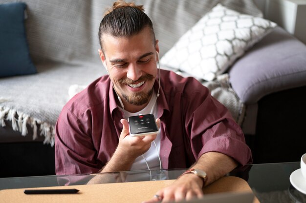 Medium shot smiley man with phone