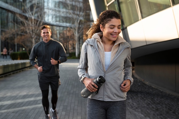 Medium shot smiley people running