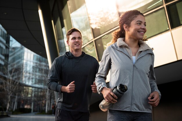 Medium shot smiley people running