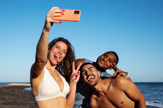 Medium shot smiley people taking selfie