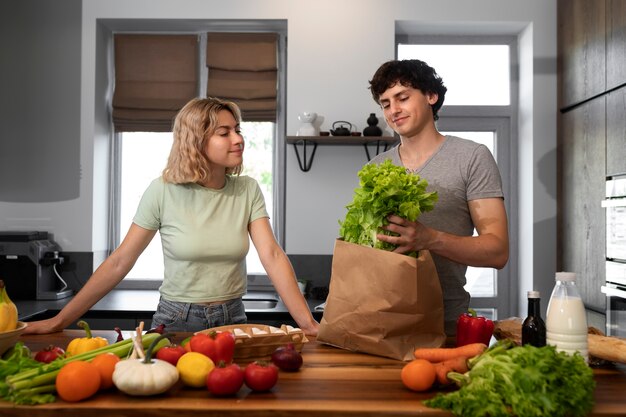 Medium shot smiley people with groceries