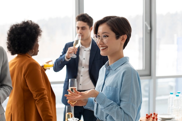 Medium shot smiley people at work event