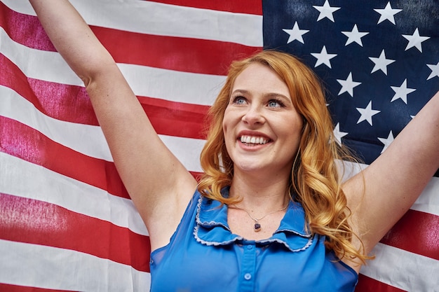 Medium shot smiley woman celebrating 4th of july