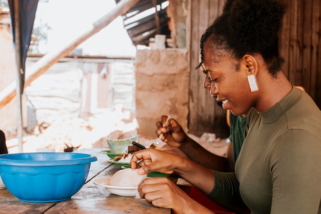 Medium shot smiley woman cooking