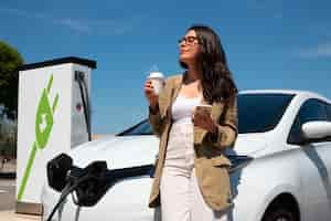 Free photo medium shot smiley woman enjoying coffee