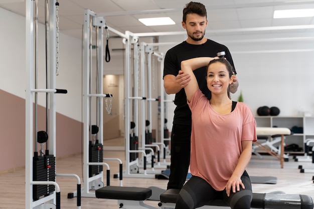 Medium shot smiley woman exercising