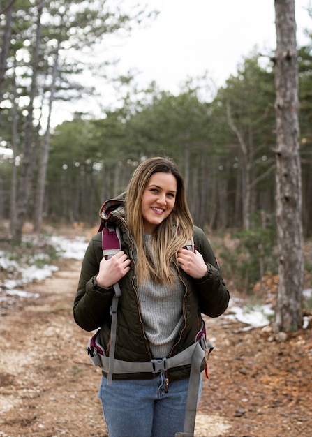 Free Photo medium shot smiley woman in forest