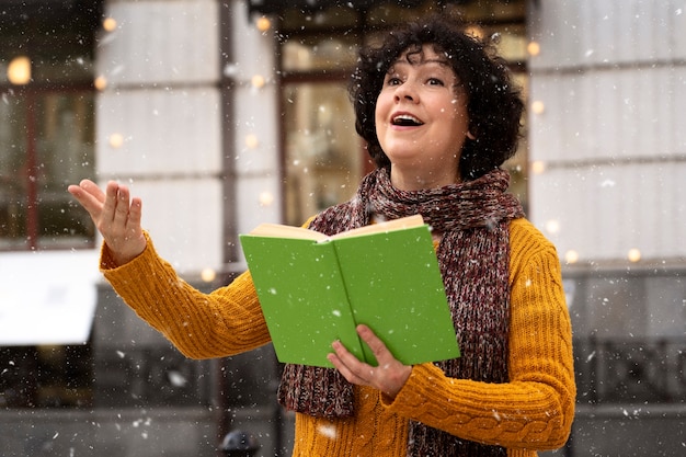 Free Photo medium shot smiley woman holding book