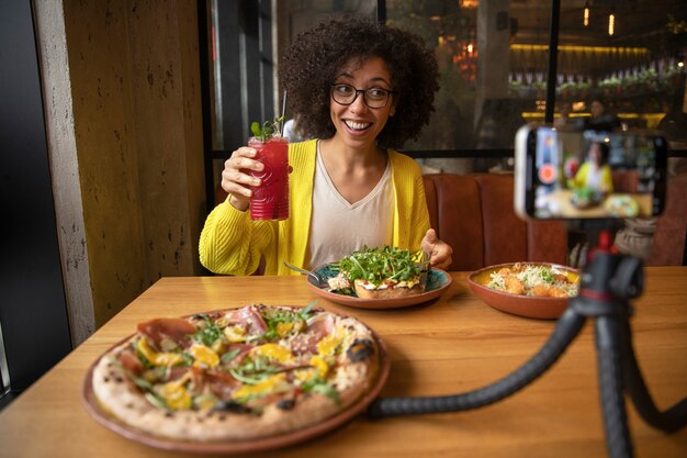 Medium shot smiley woman holding drink