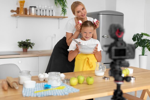 Medium shot smiley woman holding eggs