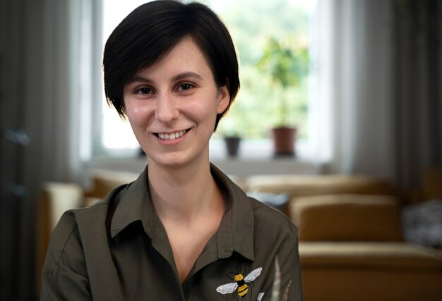 Medium shot smiley woman at home