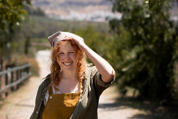 Medium shot smiley woman outdoors