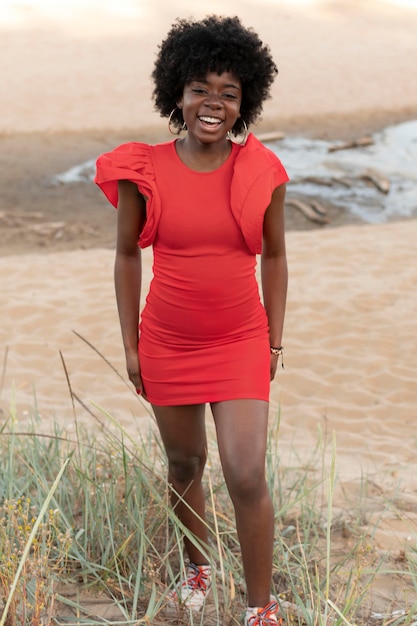 Medium shot smiley woman posing outdoors