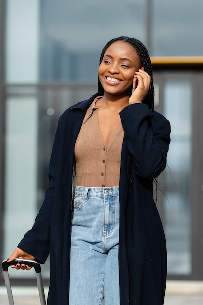 Medium shot smiley woman talking on phone