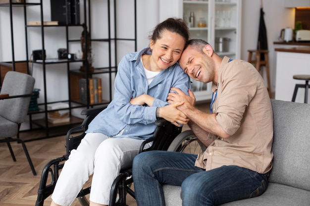 Medium shot smiley woman in wheelchair