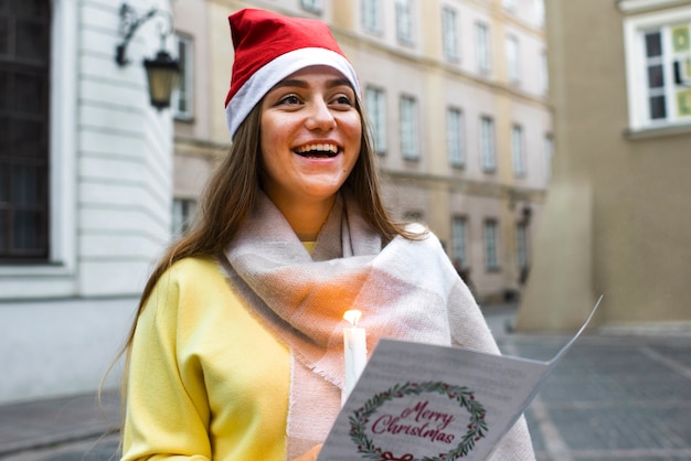 Medium shot smiley woman with candle