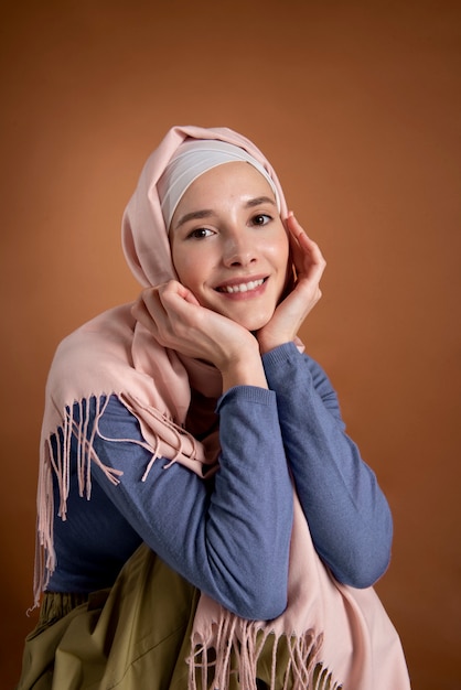 Medium shot smiley woman with hijab