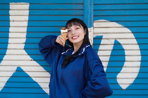 Free Photo medium shot smiley woman with ice cream cone