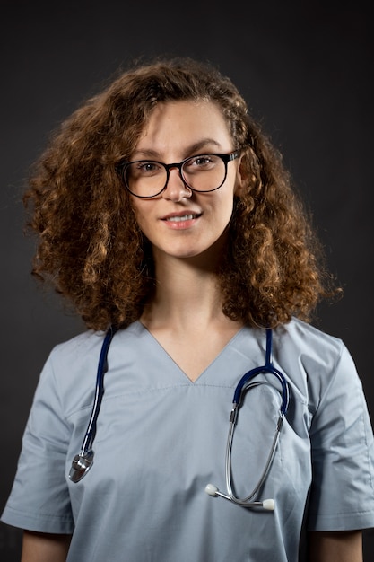 Medium shot smiley woman with stethoscope