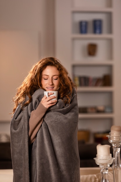 Medium shot smiley woman with tea cup