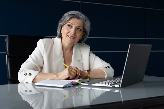 Medium shot smiley woman working