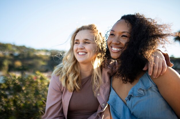 Medium shot smiley women in nature