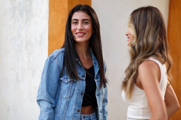 Medium shot smiley women spending time outdoors