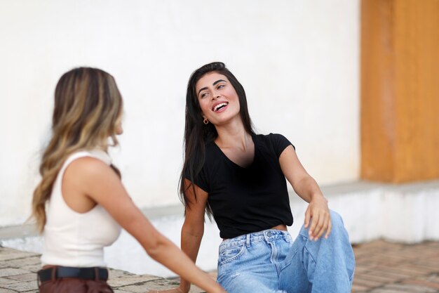 Medium shot smiley women spending time outdoors