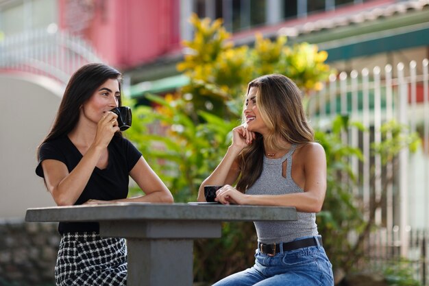 Medium shot smiley women spending time outdoors