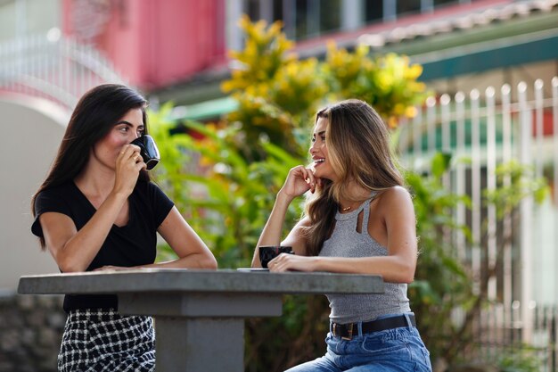 Medium shot smiley women spending time outdoors