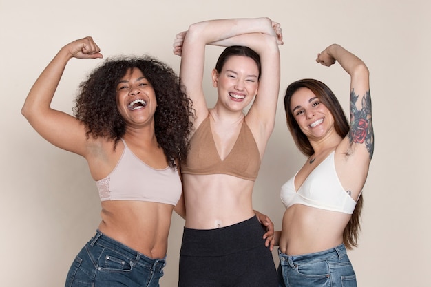 Medium shot smiley women studio portrait