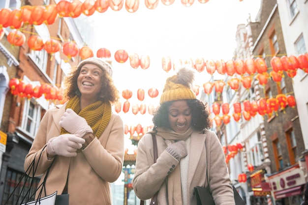 Free Photo medium shot smiley women walking together