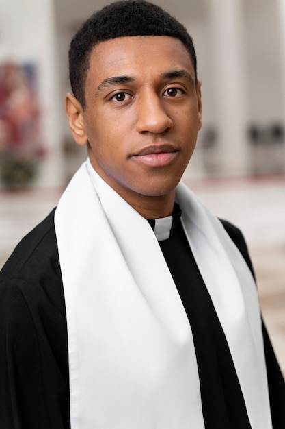 Medium shot smiley young priest