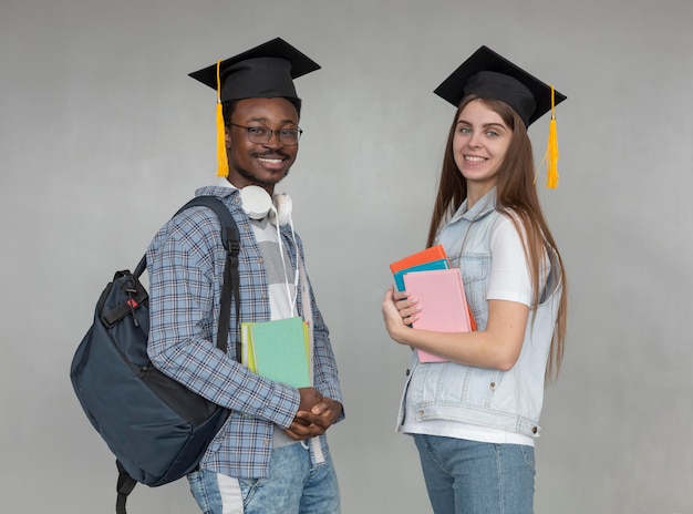 Medium shot students wearing caps