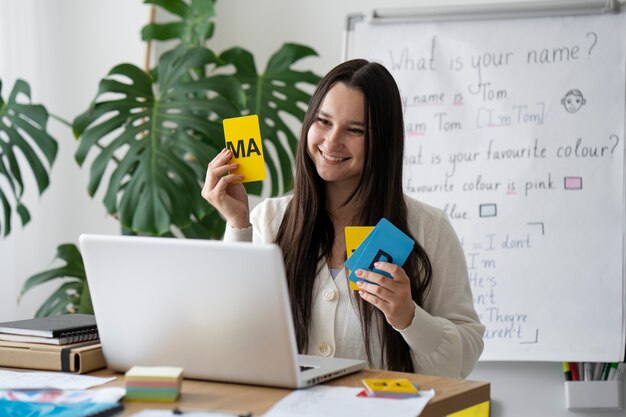 Medium shot teacher explaining with cards